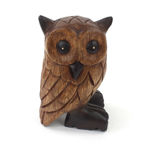 Carved Rain Tree owl figurine, straight-on front view on white background, dark talons and beak visible