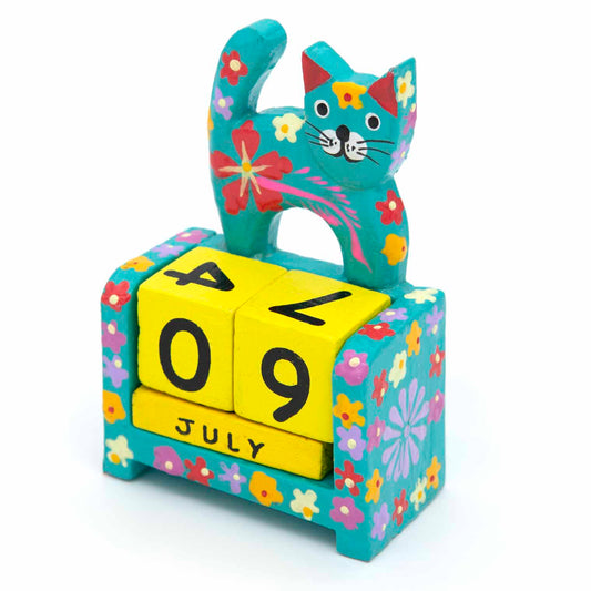 Teal painted wooden cat calendar with yellow date blocks showing July, front view on white