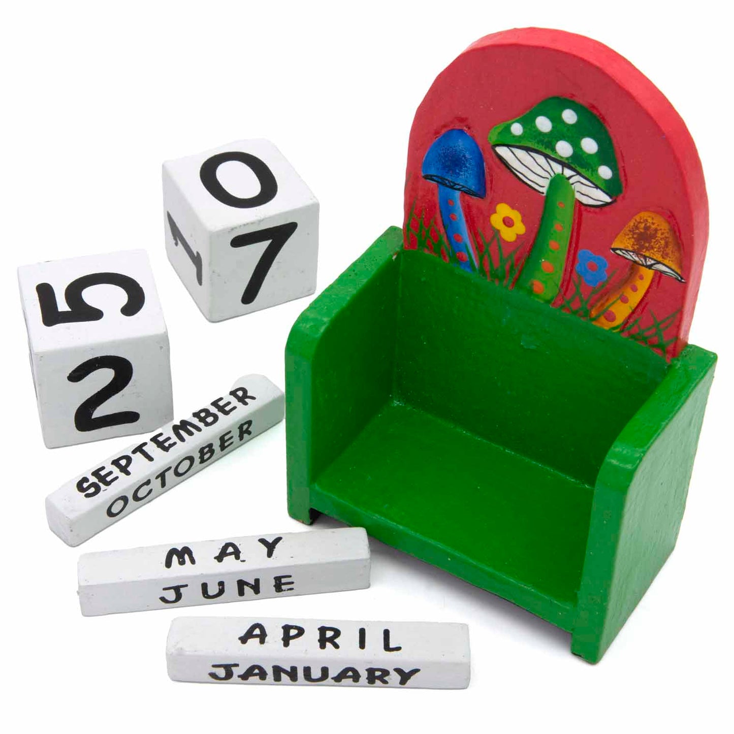 Mushroom calendar components laid out: green stand, white date cubes and month bars, Indonesia