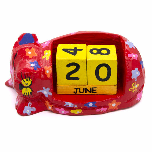Carved wooden sleeping cat calendar, front view showing yellow date blocks and June month bar