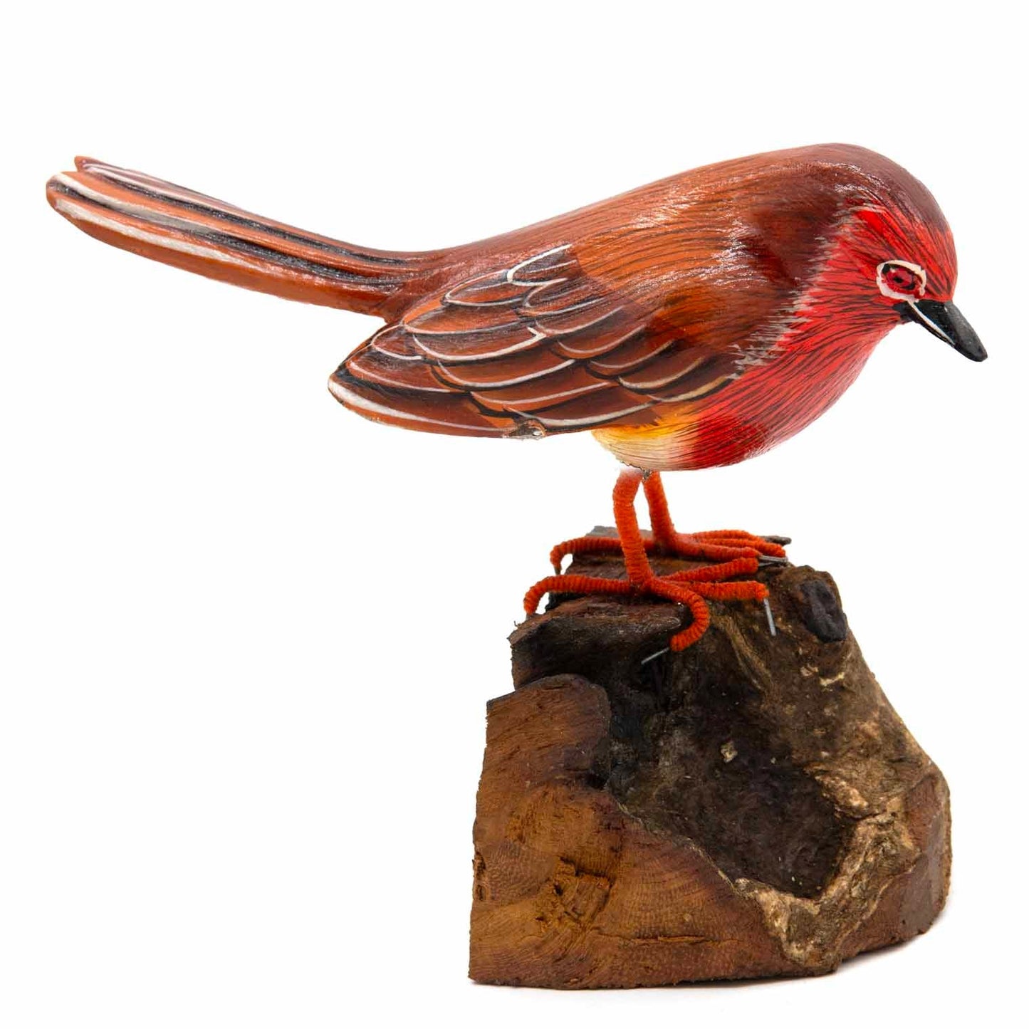 Carved robin figurine, low angle showing red breast fading to yellow belly and wire claws