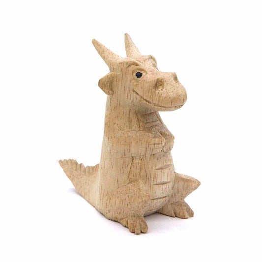 Mini dragon carving in pale Albizia wood, seated upright, three-quarter front view, Indonesia