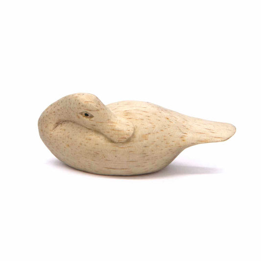 Hand-carved Albizia wood sleeping duck, bill tucked to wing, side profile, Indonesia