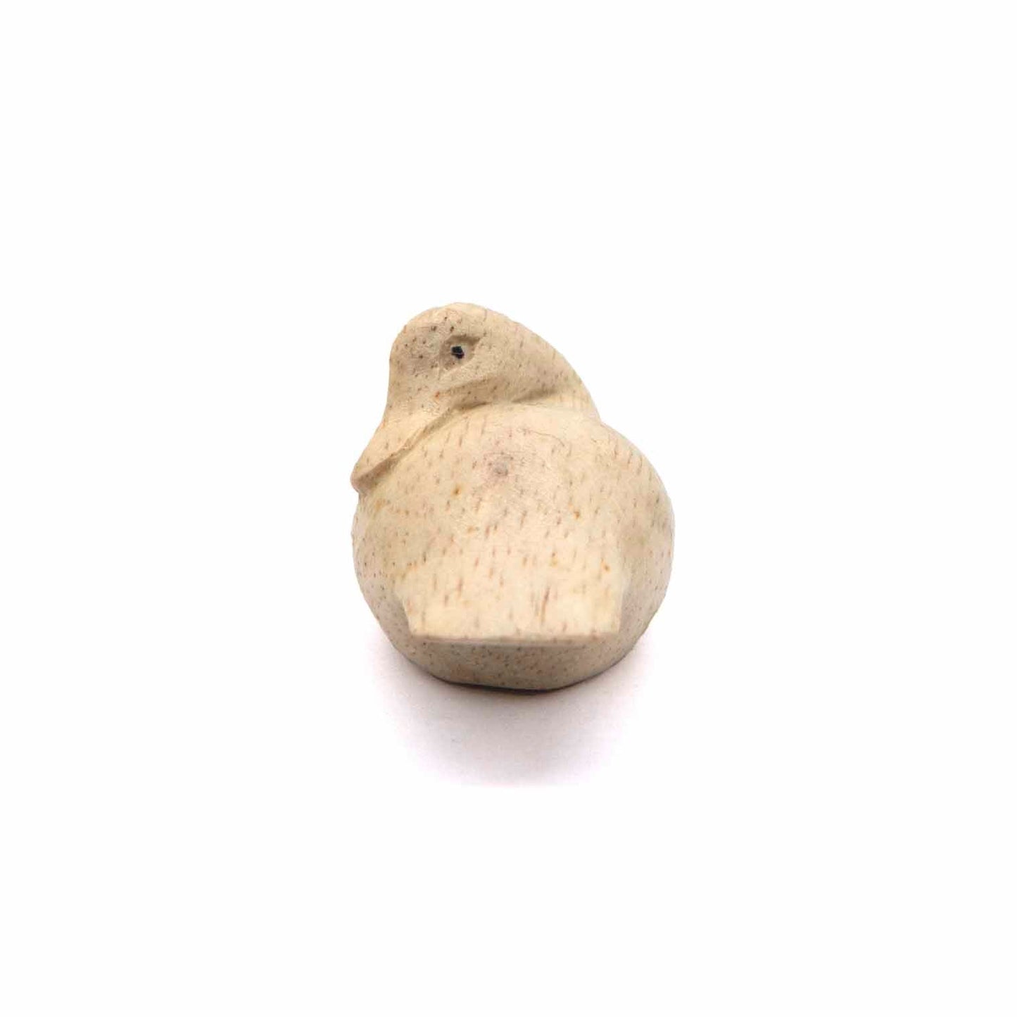 Front-on view of small Albizia wood sleeping duck carving showing face and bill detail