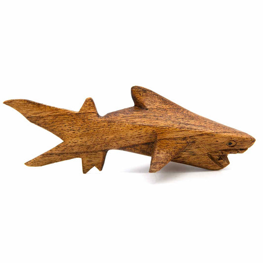 Amber-stained wooden shark carving lying flat, open jaw and spread fins, side view, Indonesia