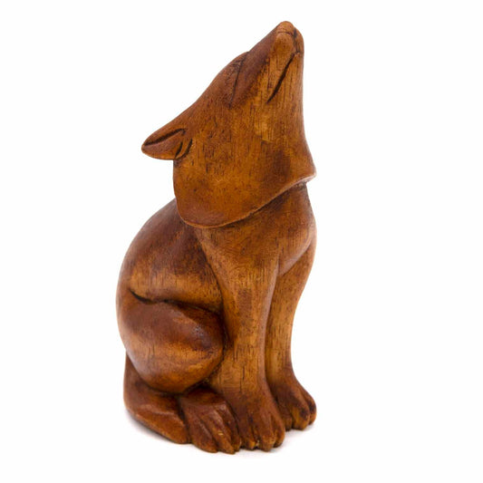 Medium amber-stained wood howling wolf carving, three-quarter view showing head thrown back
