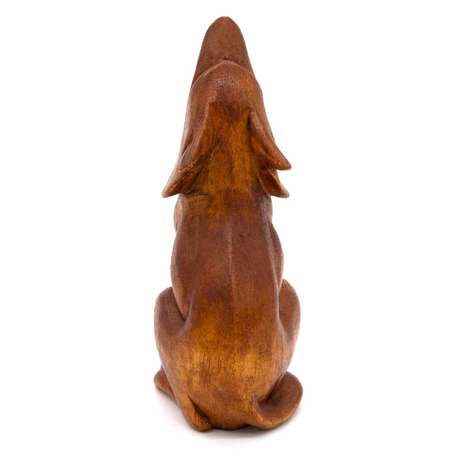 Carved amber wood wolf, three-quarter side view showing full body and paw detail