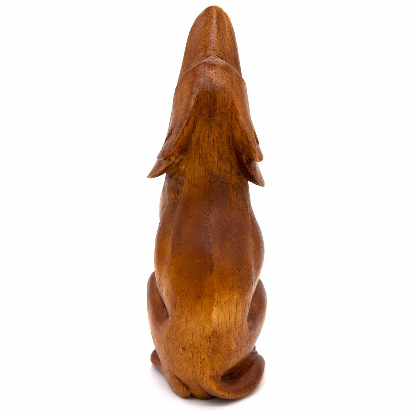 Large amber-stained wood wolf carving, rear three-quarter view showing broad haunches and grain