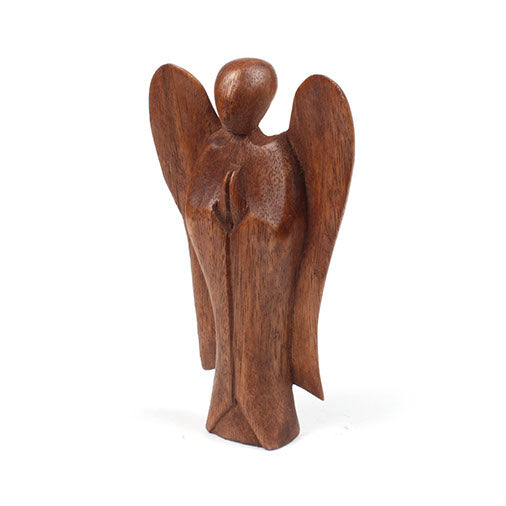 Three-quarter view of small abstract wooden angel showing wing and robe planes, Indonesia