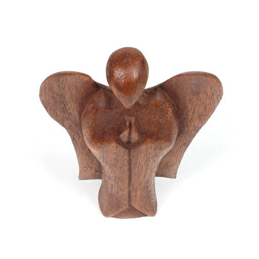 Low-set abstract wooden angel carving with wide spread wings, front view