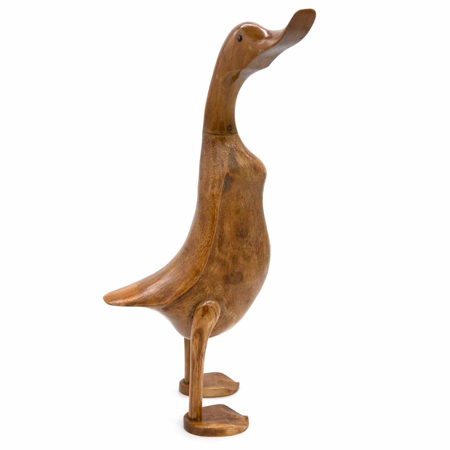 Bamboo root duck sculpture, side view showing raised foot and swept-back wing, Indonesia