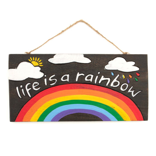 Front view of Life Is a Rainbow wood plaque on white background, full rainbow, clouds and sun detail on dark-stained ground