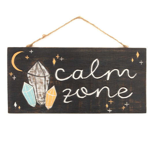 Front view of Calm Zone wood plaque on white background, showing grey, blue and amber crystal forms, crescent moon and white