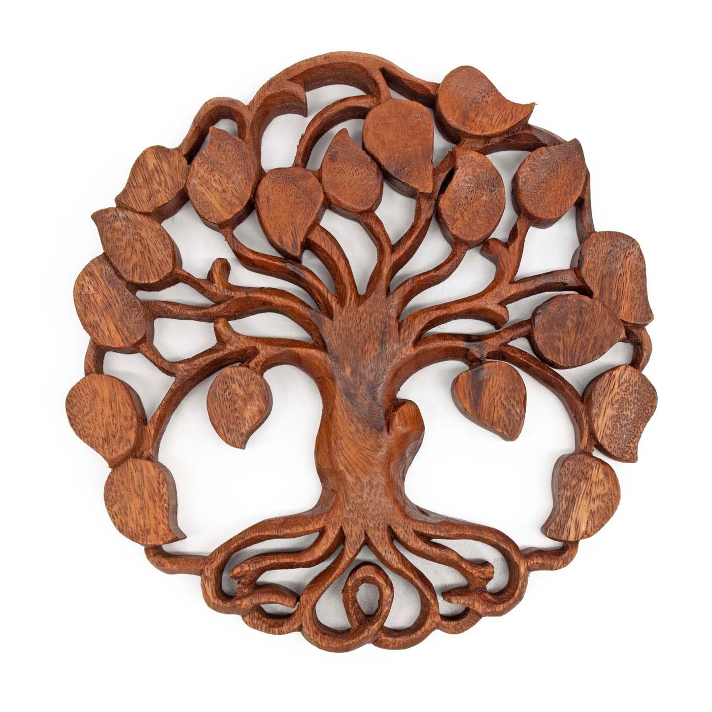 Front view of openwork carved wood tree of life disc, scrolled roots and spreading branches, white background