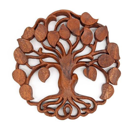 Front view of openwork carved wood tree of life disc, scrolled roots and spreading branches, white background