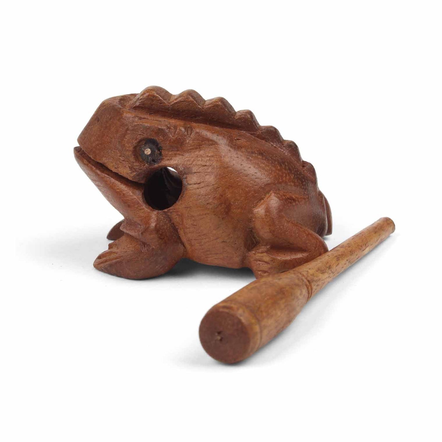 Mini carved frog guiro with striker laid alongside, showing relative scale on white background