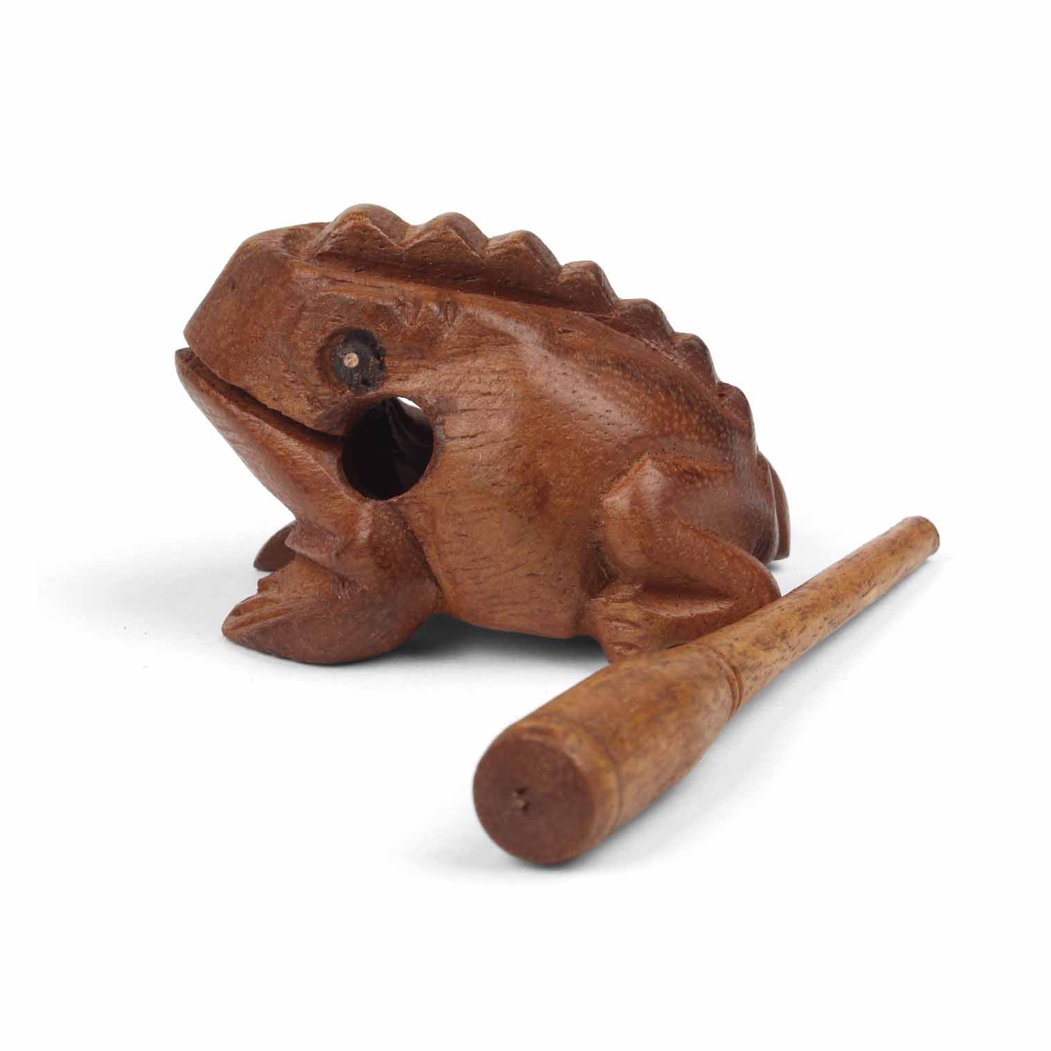 Mini carved frog guiro with striker laid alongside, showing relative scale on white background