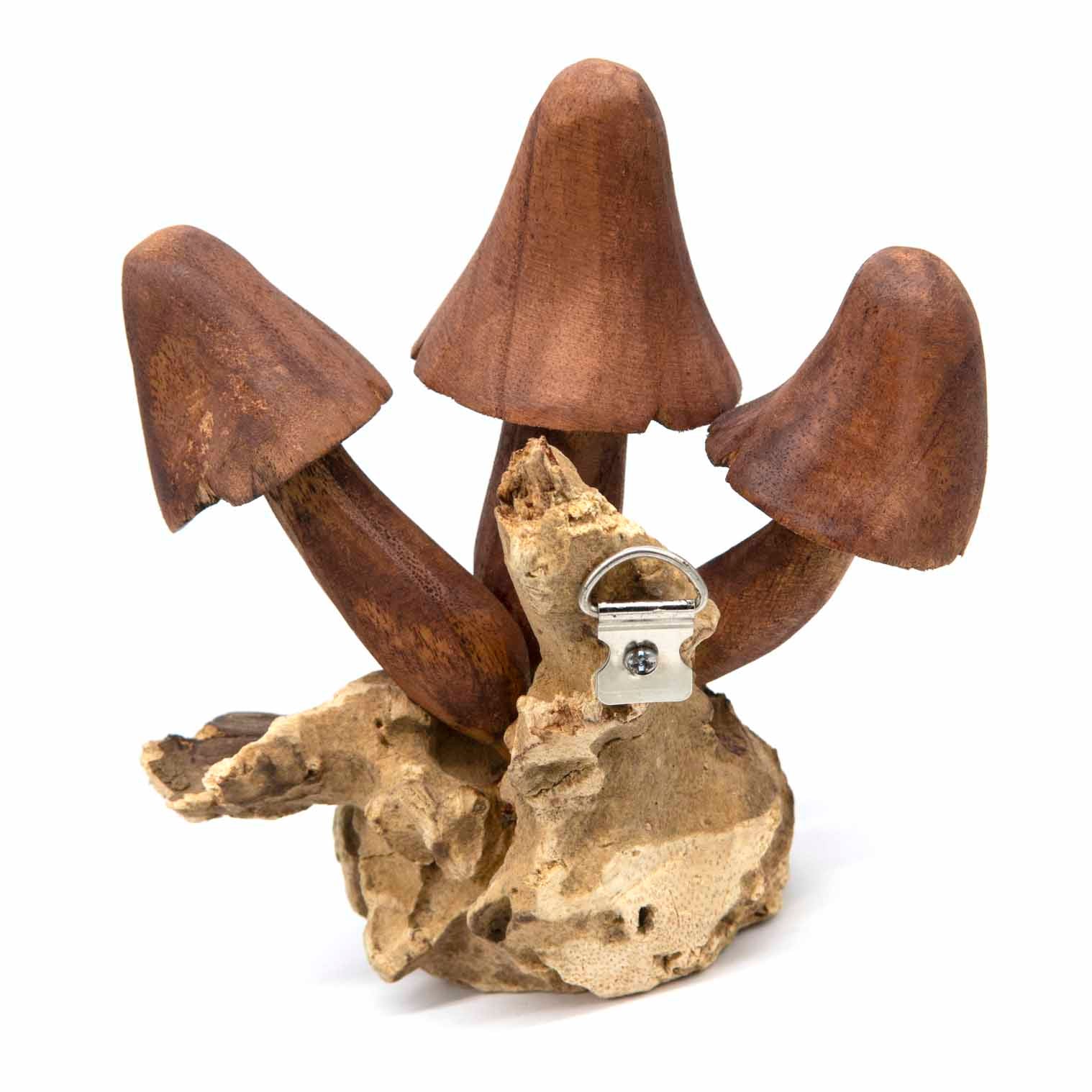 Reverse of large carved mushroom wall piece showing fitted metal hanging hook on burl base