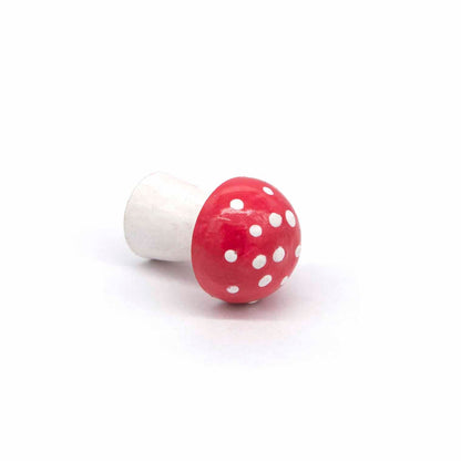 Mini wooden fly agaric mushroom lying on its side showing spotted cap detail, Indonesia