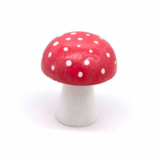 Hand-painted wooden toadstool, red cap with white spots on broad white stem, front view on white