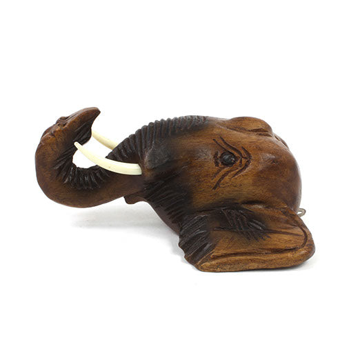 Carved wooden elephant head wall mount in Raintree, three-quarter side view showing ear and brow carving