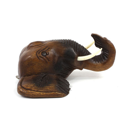Carved Raintree elephant head wall mount, side view showing raised trunk as hook and ear detail