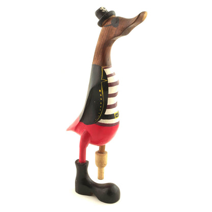 Bamboo root duck in black pirate coat with red trousers and skull hat, side view showing natural root beak, white background