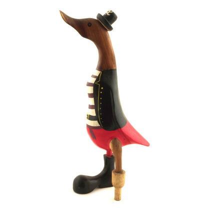 Bamboo root pirate duck in black coat and red trousers, opposite side view showing peg leg and boot detail, white background