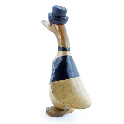 Bamboo root groom duck, opposite side view showing natural root body beneath black painted coat, white background