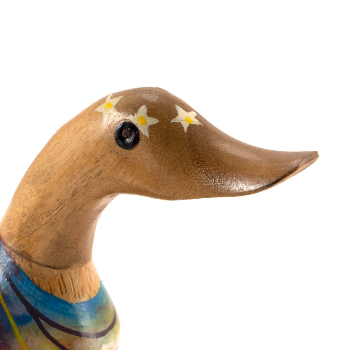 Close-up of bamboo root duck head showing flower headband detail and carved beak