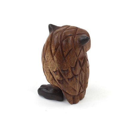 Side-rear view of carved acacia owl figurine showing tail and wing feather carving detail