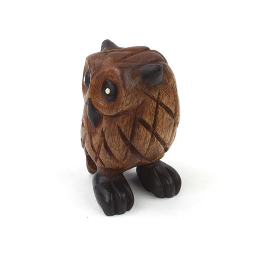 Small carved wooden owl from above and front, showing rounded body and dark eye detail