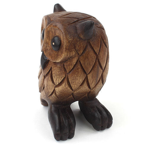 Rain Tree wood owl carving, three-quarter front view showing scale-carved body and dark feet