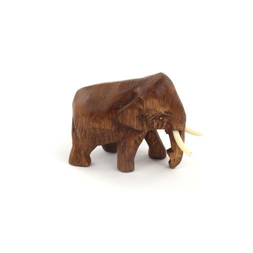 Mini carved wooden elephant in Raintree, side profile showing ear and body form, white background