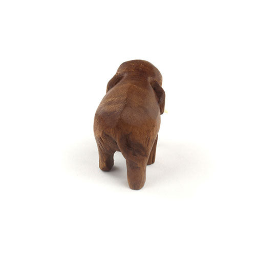 Rear view of mini hand-carved Raintree elephant, smooth rounded back, white background