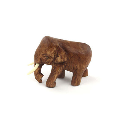 Small Raintree elephant carving facing right, trunk down, showing close grain and tusk, Thailand