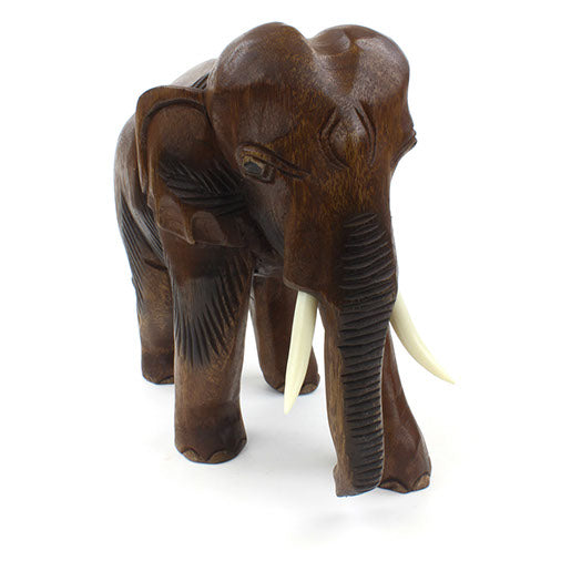 Extra large Raintree elephant carving, front view with deeply worked trunk and dark-stained body passages