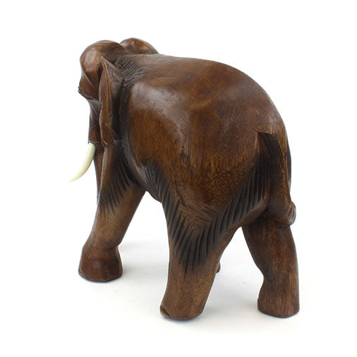 Rear view of extra large hand-carved Raintree elephant showing rounded haunches and tail detail