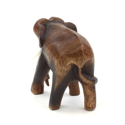 Rear view of medium hand-carved Raintree elephant showing tail and rounded haunches, white background