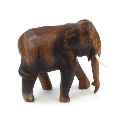 Medium Raintree elephant carving, three-quarter side view showing smooth back and ear detail
