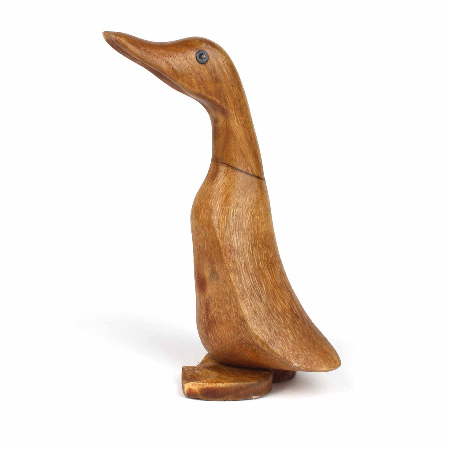 Full side profile of carved bamboo root duckling on white background, showing smooth body and flat base