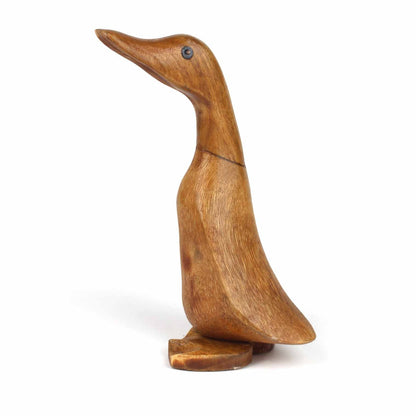 Full side profile of carved bamboo root duckling on white background, showing smooth body and flat base
