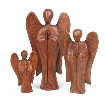 Three abstract wooden angel carvings in small, medium and large sizes, Balinese Raintree wood