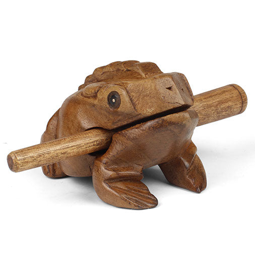 Carved Rain Tree frog guiro, straight side view on white background with striker in mouth