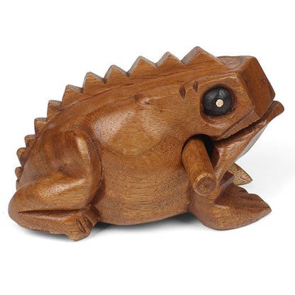 Medium acacia frog guiro, side view on white background showing ridged back profile and striker in mouth