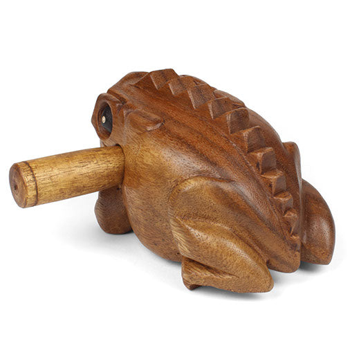 Medium carved frog guiro, rear three-quarter view showing ridged back and striker passing through
