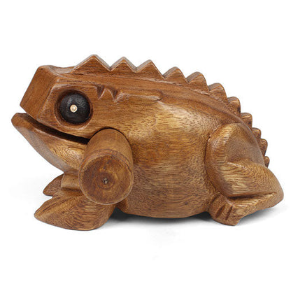 Medium acacia frog guiro, front three-quarter view without striker showing hollow mouth and carved feet
