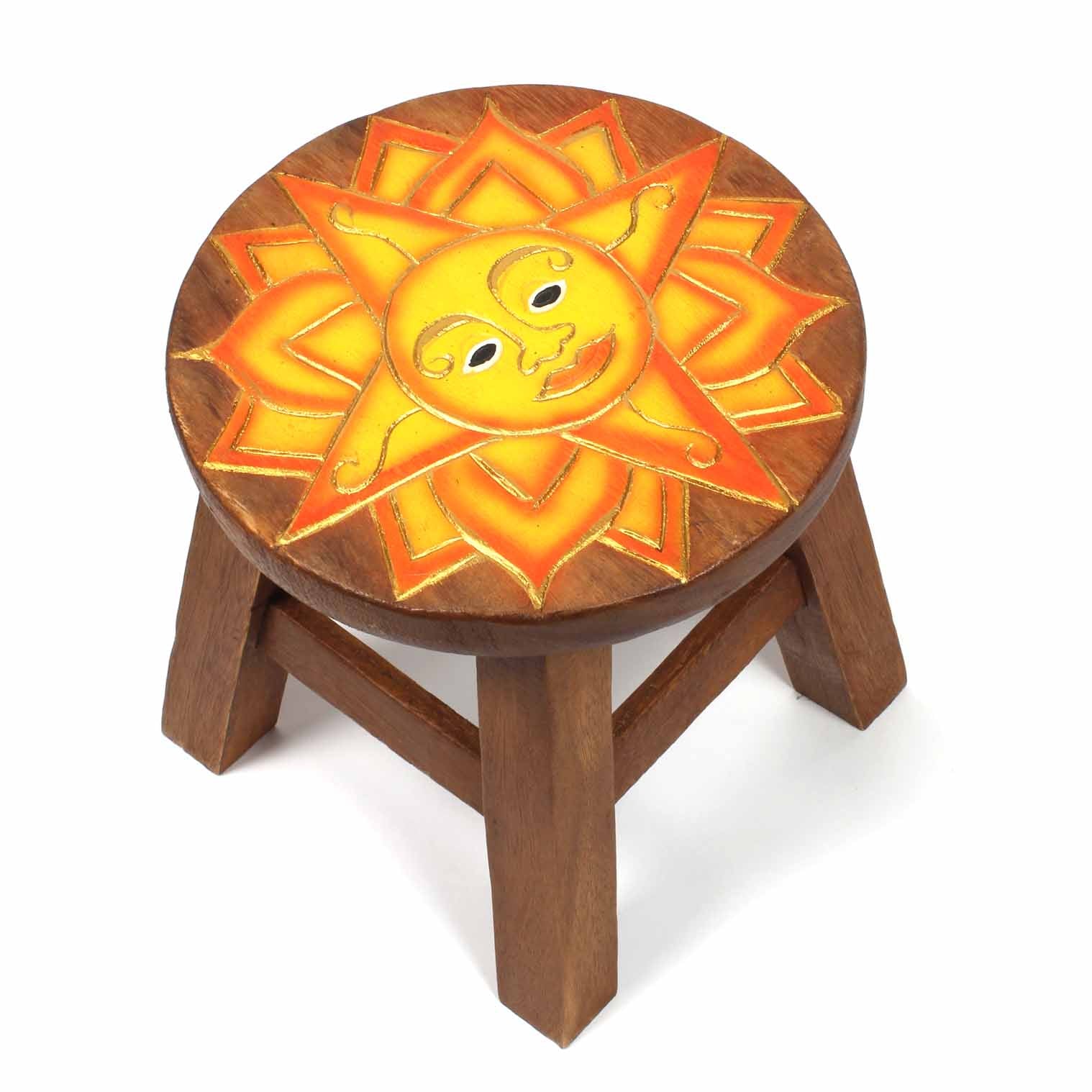 Raintree wood stool with carved sun face in yellow and orange, front three-quarter view on white background