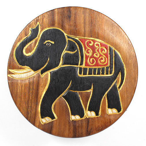 Top-down view of Raintree wood elephant stool seat, carved elephant in black with gold detail and red decorative cloth, Thail