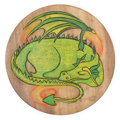 Top-down view of Raintree wood stool seat with carved sleeping green dragon surrounded by painted orange flame, Thailand